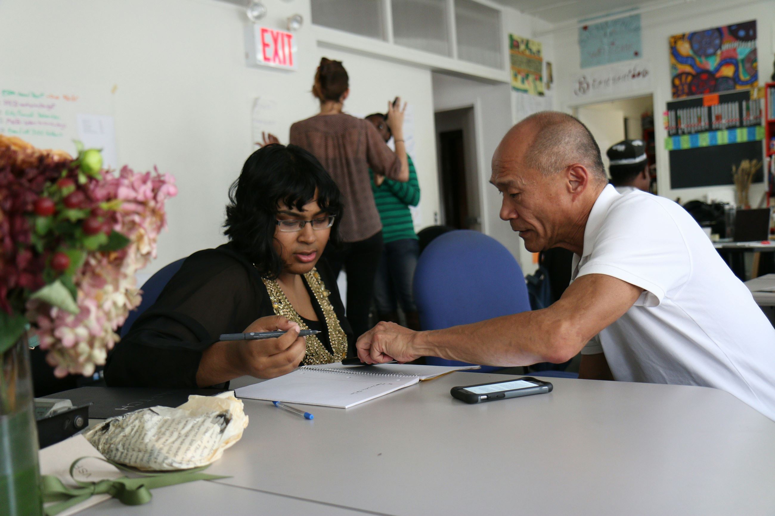 A tutor working with an adult learner
